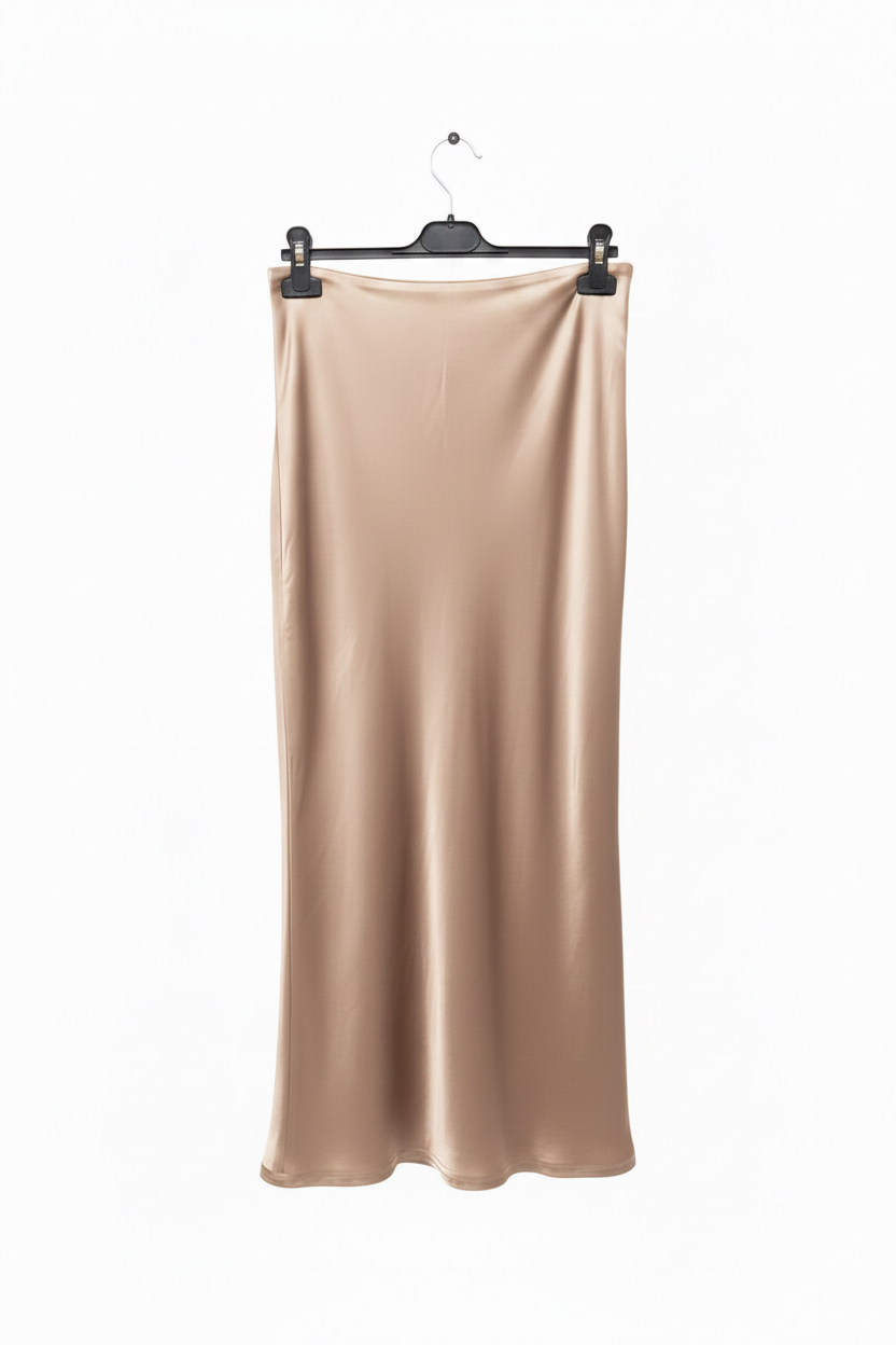 Beige satin skirt on a hanger against a white background
