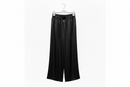 Black wide-leg pants on a hanger against a white background