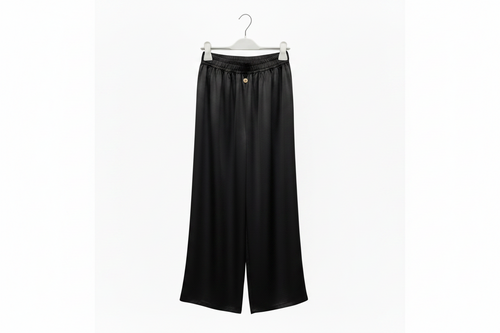 Black wide-leg pants on a hanger against a white background