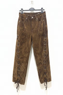 Brown corduroy pants with lace-up sides on a hanger against a white background