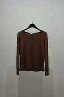 Brown long-sleeve shirt on a hanger against a plain background