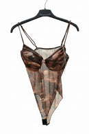 Brown sheer bodysuit on a hanger against a white background