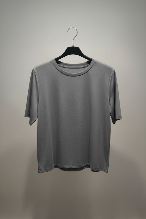Gray t-shirt on a black hanger against a gray background