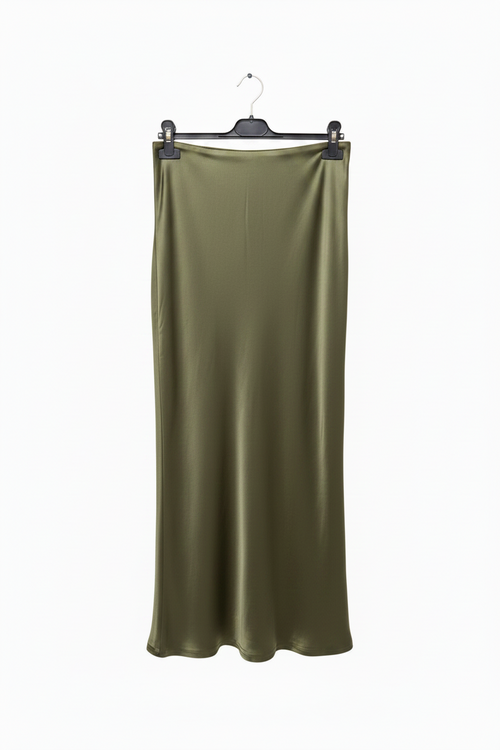 Green satin skirt on a hanger against a white background