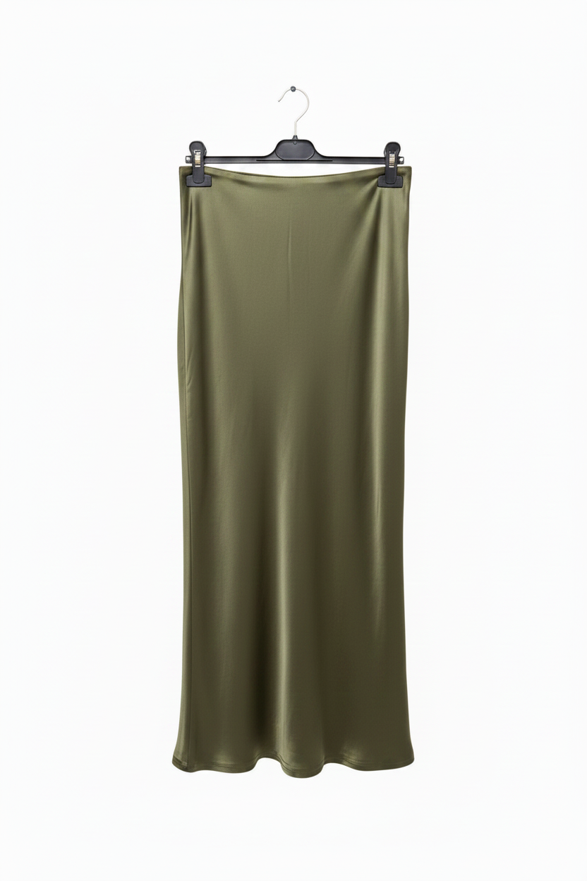 Green satin skirt on a hanger against a white background