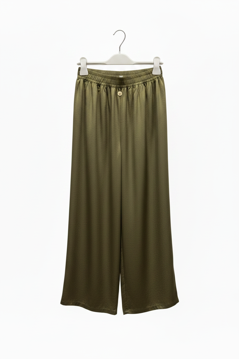 Green wide-leg pants on a hanger against a white background