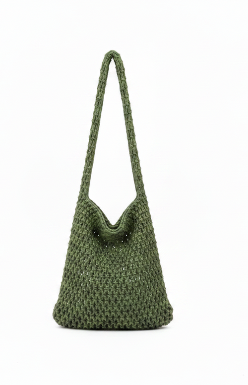 Green knitted handbag on a white background