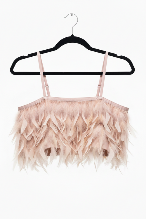 Pink feathered top on a black hanger against a white background