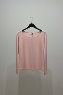 Pink long-sleeve shirt on a hanger against a plain background