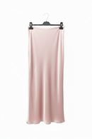 Pink satin skirt hanging on a hanger against a white background