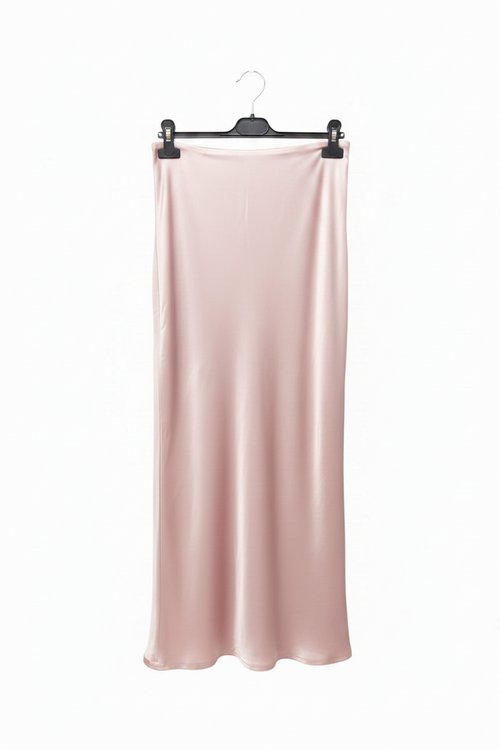 Pink satin skirt hanging on a hanger against a white background
