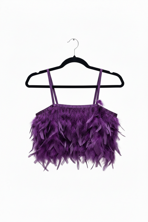 Purple feathered top on a black hanger against a white background