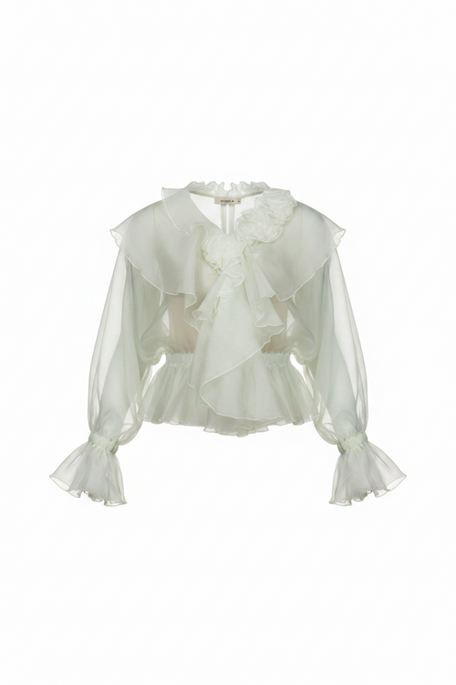 White blouse with ruffled details on a white background