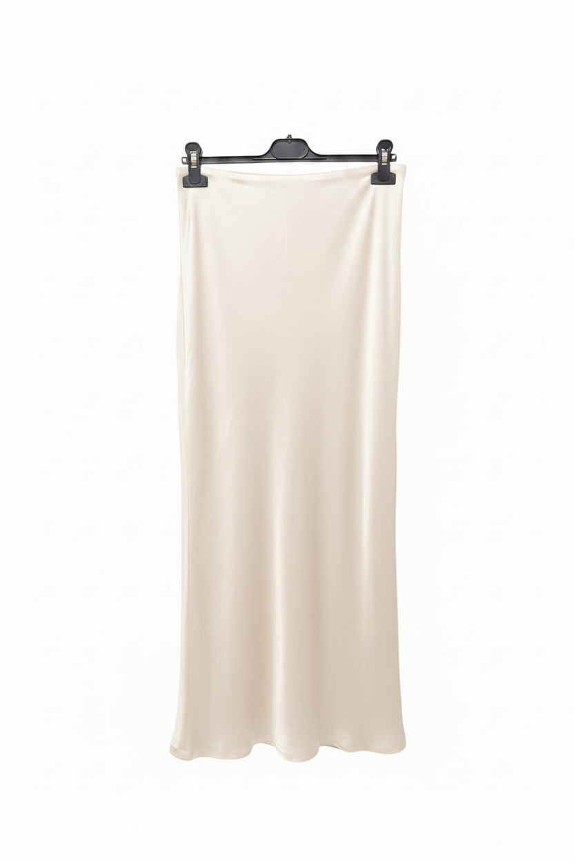 White skirt on a black hanger against a white background