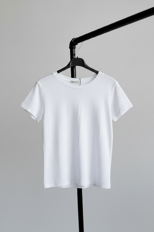 White t-shirt on a hanger against a gray background