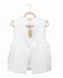 White vest on a hanger with a visible brand tag against a white background