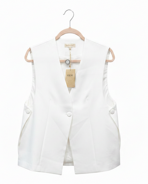 White vest on a hanger with a visible brand tag against a white background